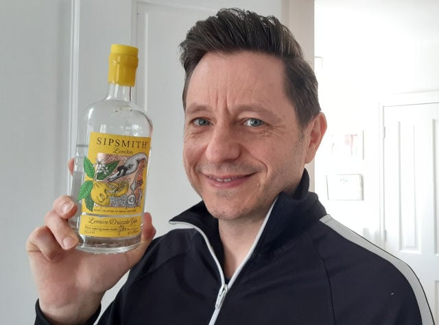 Andrew holding a bottle of Sipsmith Lemon Drizzle Gin