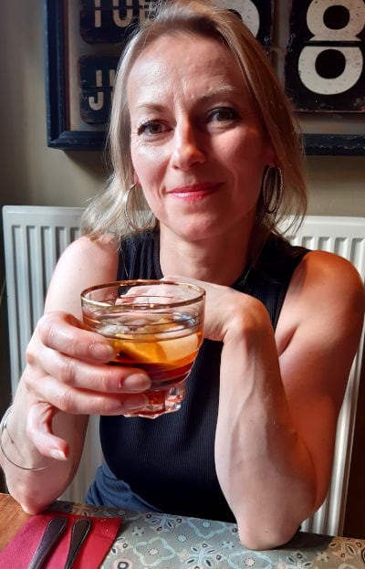 Ingrid with Martini Rosso, neat with ice & an orange wedge