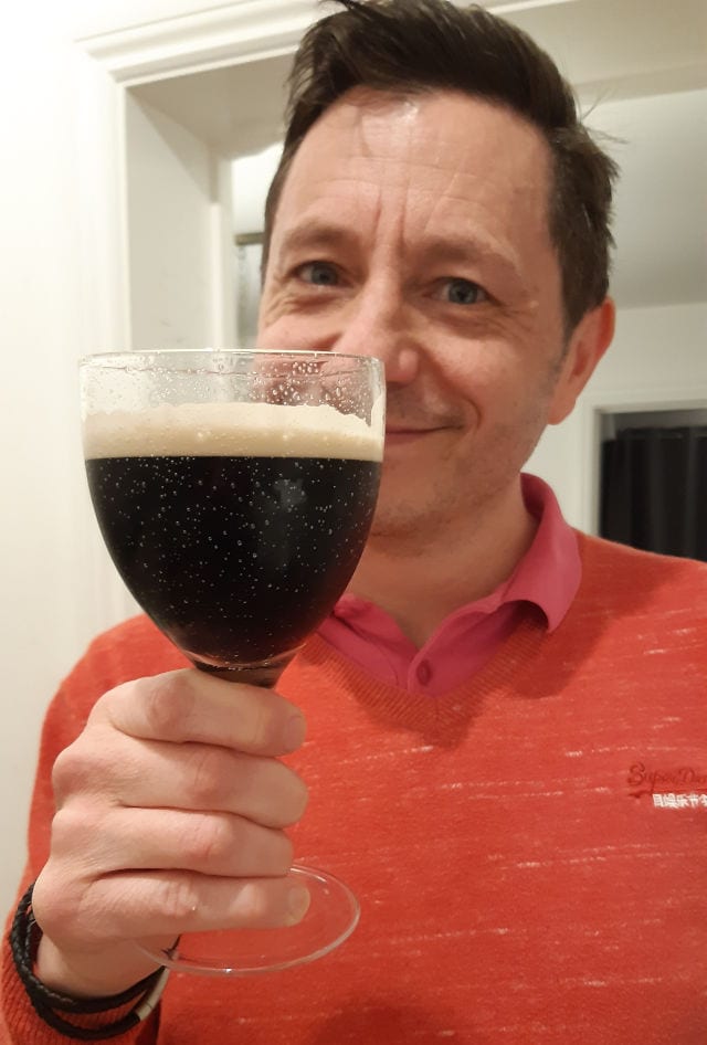 Andrew drinking stout
