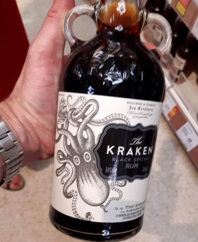 Andrew holding a bottle of Kraken rum