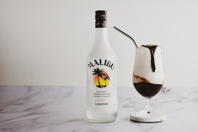 Malibu coconut rum liqueur bottle and cocktail glass