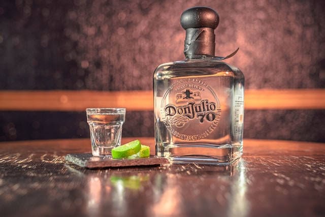 bottle of Don Julio 70 Cristalino Tequila with glass