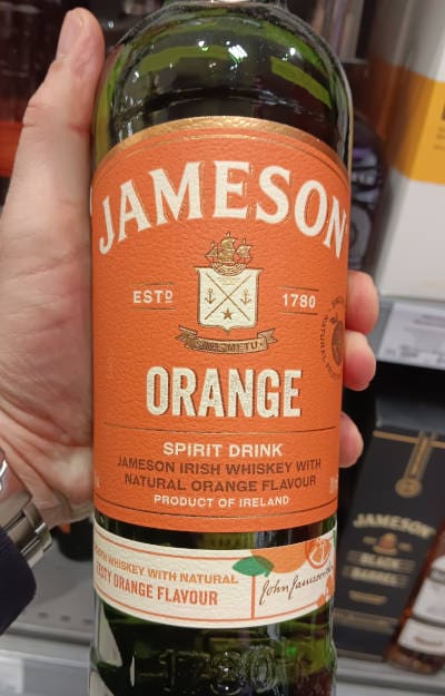Andrew holding Jameson Orange Irish Whiskey